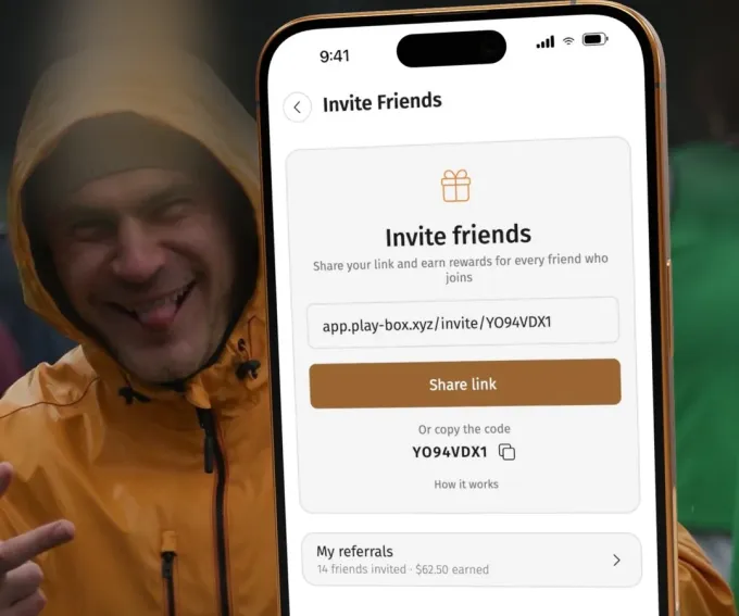 Playbox invite friends screen with a personal referral link and code