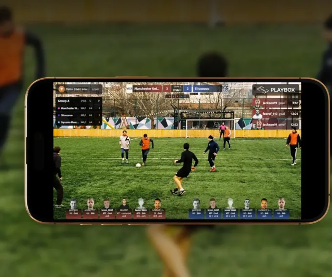 Phone streaming a football match with score and lineup graphics